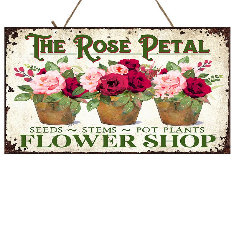 Letrero de madera hecho a mano de la tienda de flores de pétalos de rosa